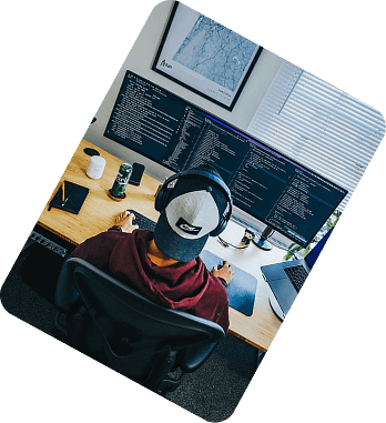Programmer working at multiple monitors